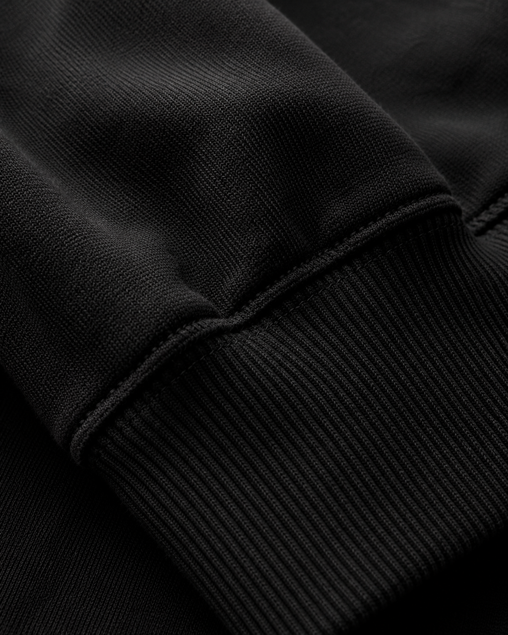 A. Manso black fleece hoodie with relaxed boxy fit