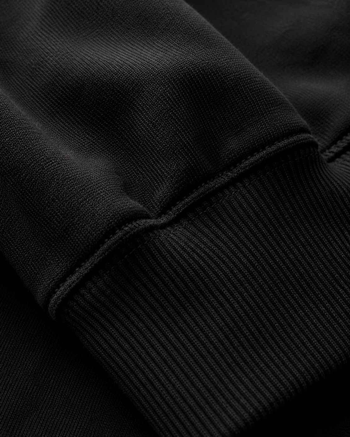 A. Manso black fleece hoodie with relaxed boxy fit