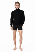 Male editorial model wearing HIGH-NECK KNIT 000 by A. Manso — front view
