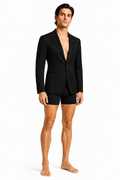Male editorial model wearing STRUCTURED WAIST BLAZER 000 by A. Manso — front view