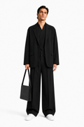 Male editorial model wearing THE SUIT WAS NEVER THE POINT by A. Manso — front view