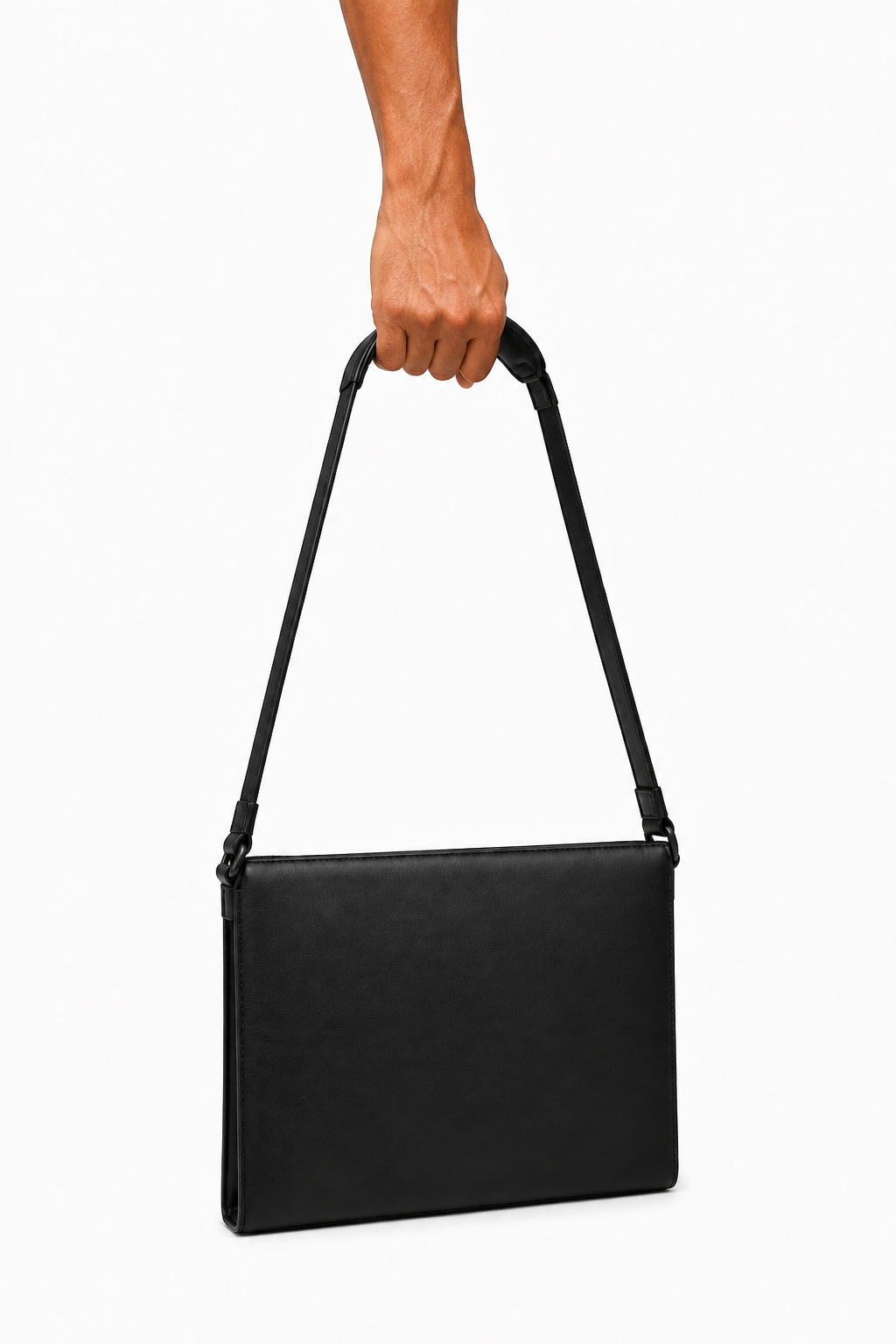 STRUCTURED LEATHER BAG 000 held by male hand — editorial view