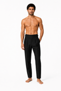 Shirtless barefoot male model wearing ITALIAN TROUSERS 000 by A. Manso, front view