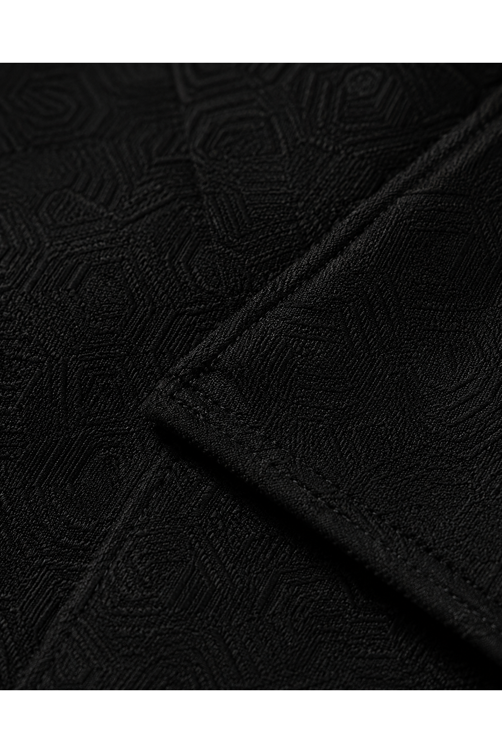 LONG COMMAND COAT 000 — black jacquard fabric texture detail
